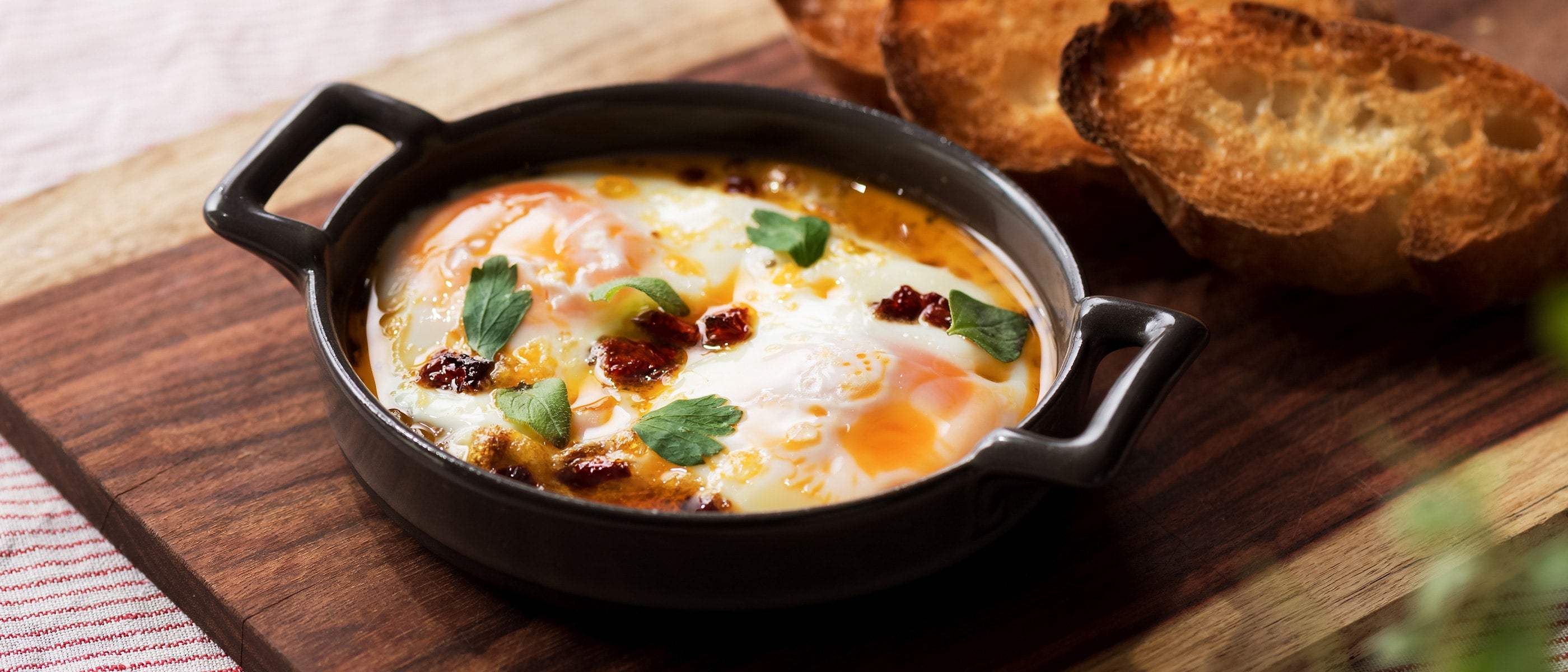 Eggs Baked in Chili Oil <br>with Dried Tomatoes and Oregano 